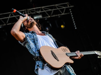 A Guy singing at concert